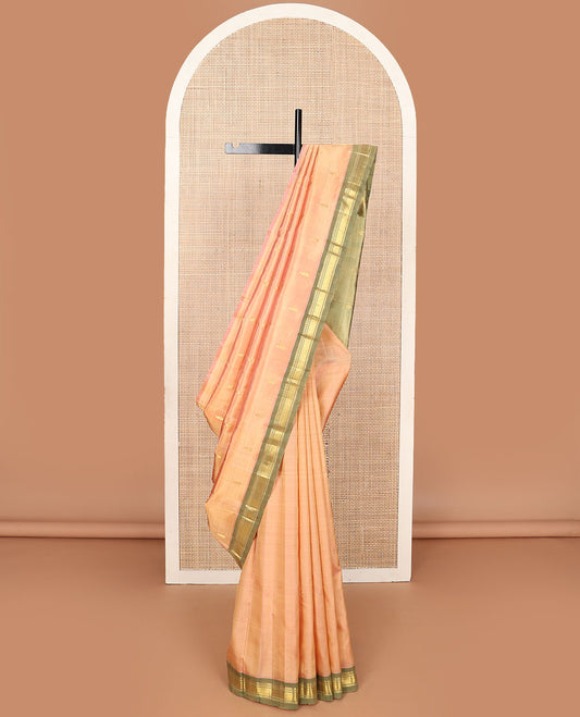 Peach zari buttas Kanchipuram silksaree, contrast one-sided border of panner sombu, banaras & mayil kann & zari design pallu