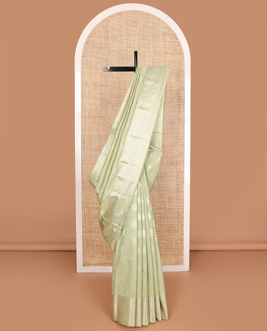 Pale green zari buttas Vasundhara silk mix saree, zari border of neli,kodi visiry,muthu, and vanki designs, and vanki pallu