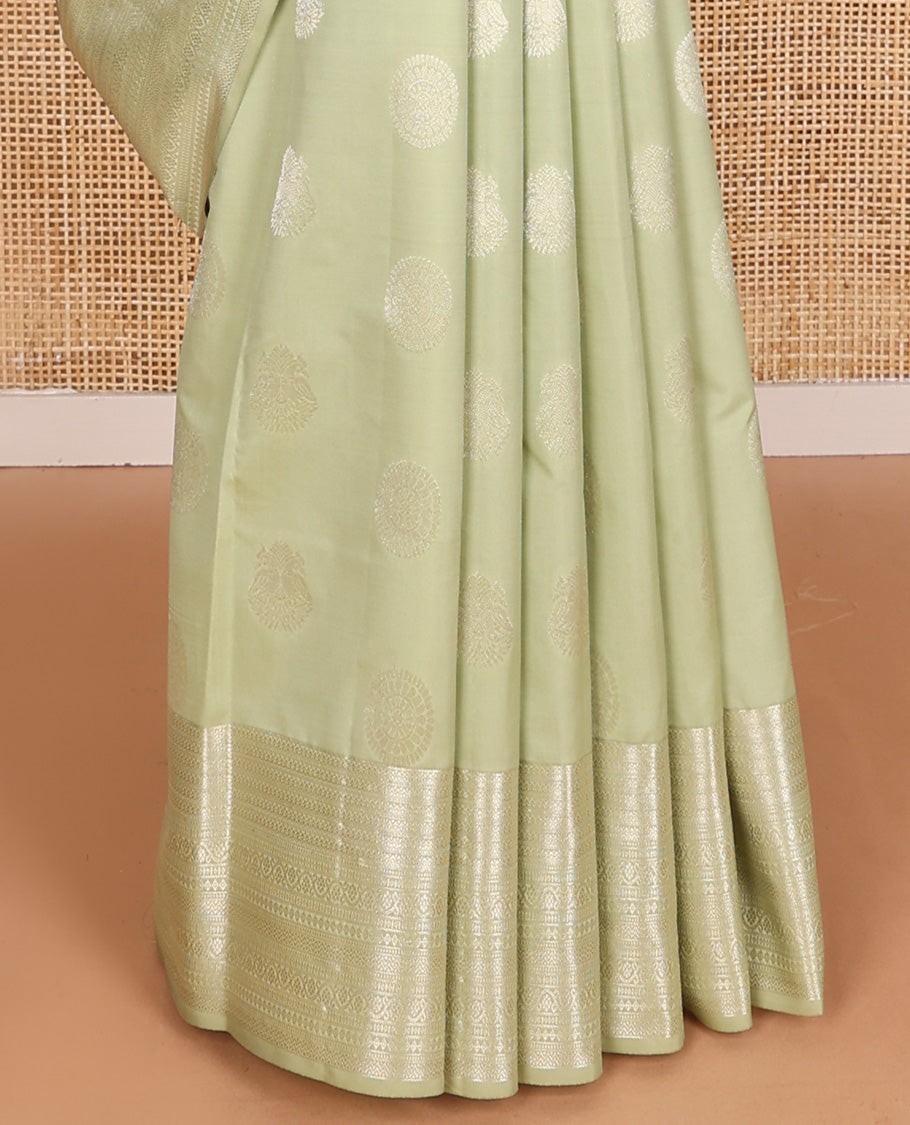 Pale green zari buttas Vasundhara silk mix saree, zari border of neli,kodi visiry,muthu, and vanki designs, and vanki pallu