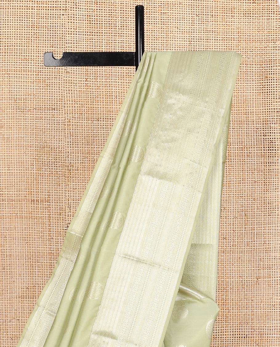 Pale green zari buttas Vasundhara silk mix saree, zari border of neli,kodi visiry,muthu, and vanki designs, and vanki pallu