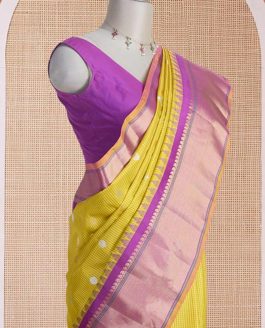 Yellow micro-checked & zari buttas gadwal silk saree, contrast temple zari border & pallu steeped with traditional designs