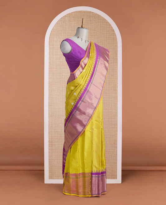 Yellow micro-checked & zari buttas gadwal silk saree, contrast temple zari border & pallu steeped with traditional designs