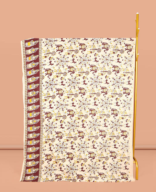 Cream Machine-Printed Kalamkari Cotton Saree, Artfully Printed with Warli-Motifs on Its Body, Complemented by a Contrast Human Motifs Printed Border, Pallu of Lord Radha Krishnan Print, and Paired with a Printed Blouse