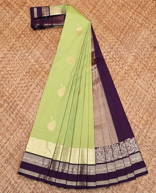 Green Budget Silk Saree, Elegantly Highlighted with Zari Buttas on Its Body, Complemented by a Contrast Traditional Zari Designs Woven Rettai Pettu Border, Grand Pallu of Diagonal Stripes, and Paired with a Contrast Blouse
