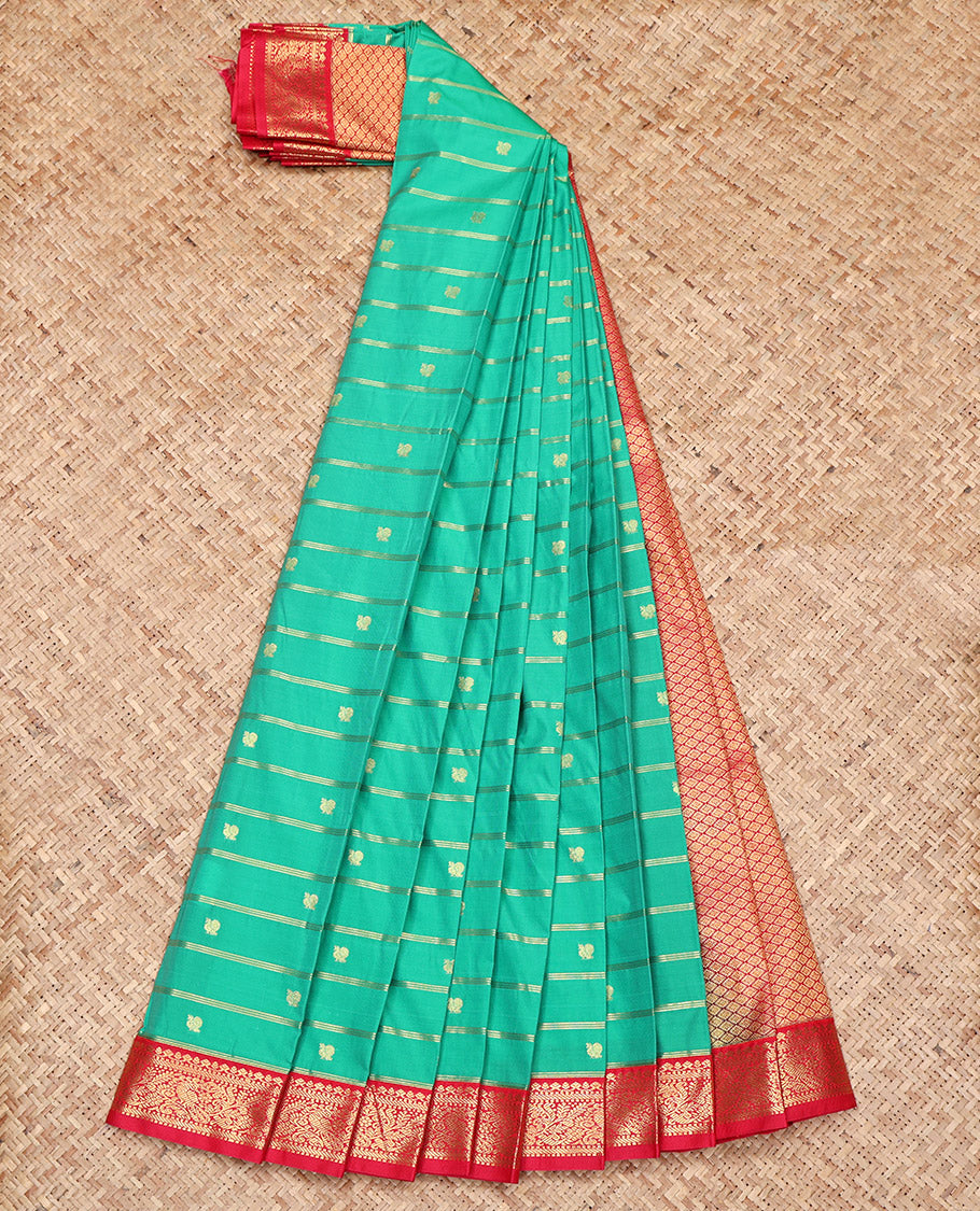Green Budget Silk Saree, Ornamented with Peacock Buttas and Zari Stripes on Its Body, Complemented by a Contrast Traditional Zari Design Border, Grand Jaal Pallu, and Paired with a Contrast Blouse