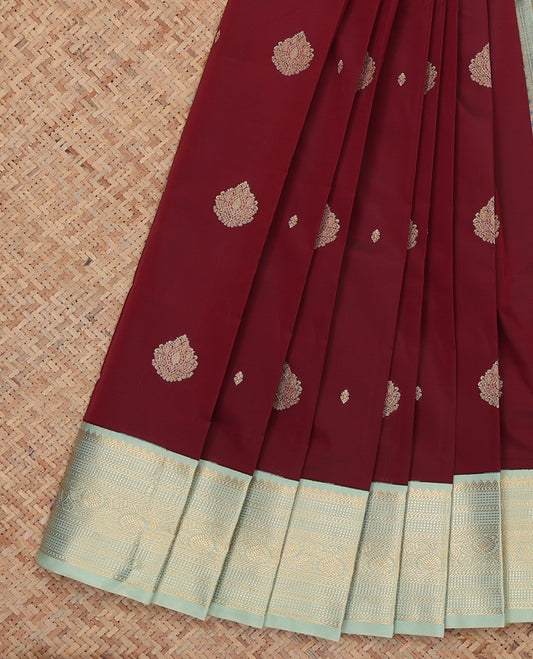 Maroon Budget Silk Saree, Ornamented with Zari Buttas, Complemented by a Contrast Traditional Zari Border, Grand Pallu, and Contrast Blouse