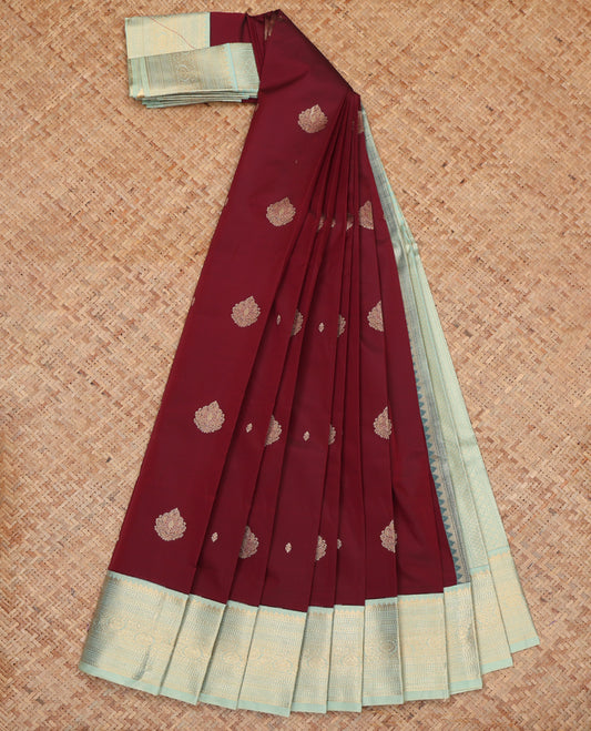 Maroon Budget Silk Saree, Ornamented with Zari Buttas, Complemented by a Contrast Traditional Zari Border, Grand Pallu, and Contrast Blouse