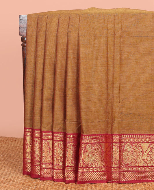 Light Brown Plain Chettinad Cotton Saree, Complemented by a Contrast Traditional Zari Border of Peacock Designs, a Pallu of Zari Stripes, and Paired with a Matching Blouse