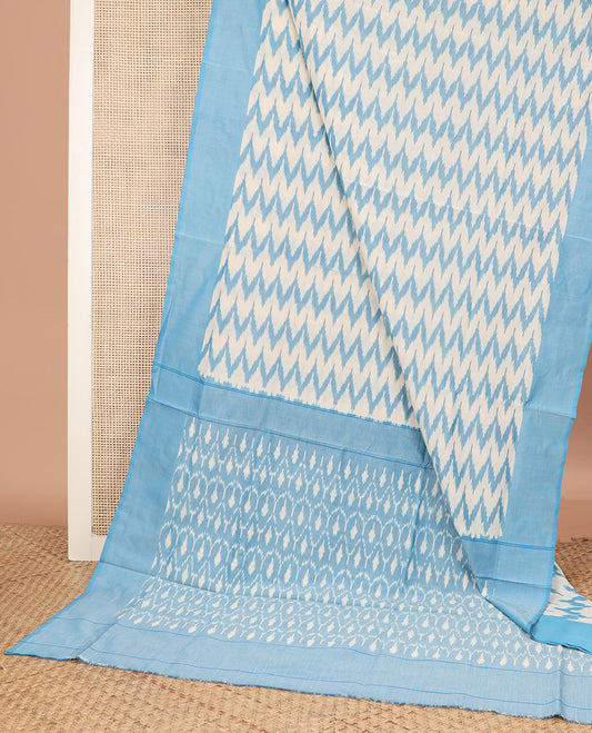 Half-White and Blue Ikkat Cotton Saree Enthralled with Chevron Stripes, Complemented by a Contrast Border, and Pallu of Ikkat Jaal Patterns