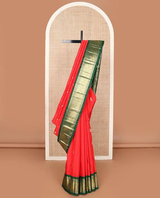 Red zari buttas Kanchipuram silksaree, contrast one-sided korvai border of thilakam mokku, & jaal design & floral design pallu