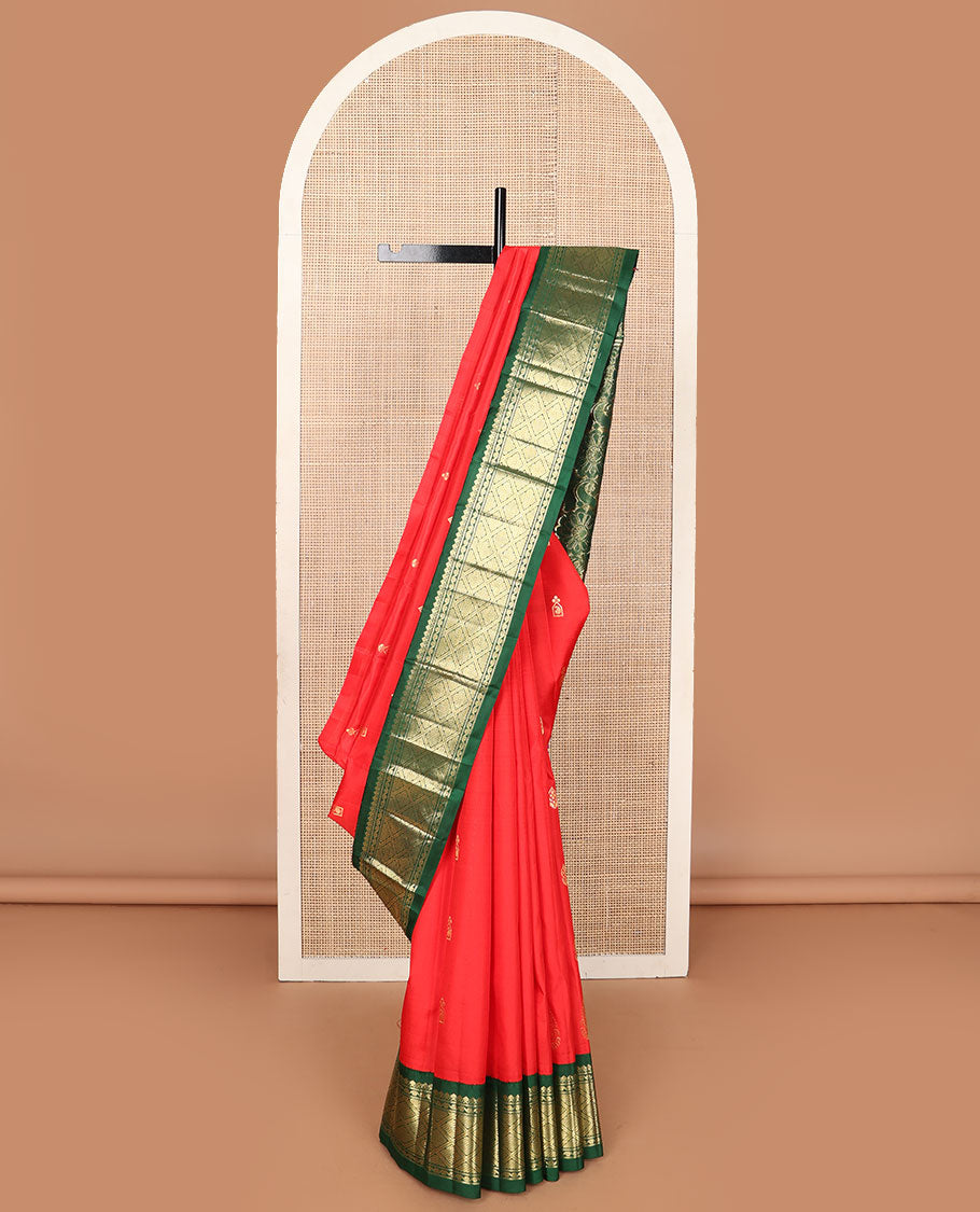 Red zari buttas Kanchipuram silksaree, contrast one-sided korvai border of thilakam mokku, & jaal design & floral design pallu