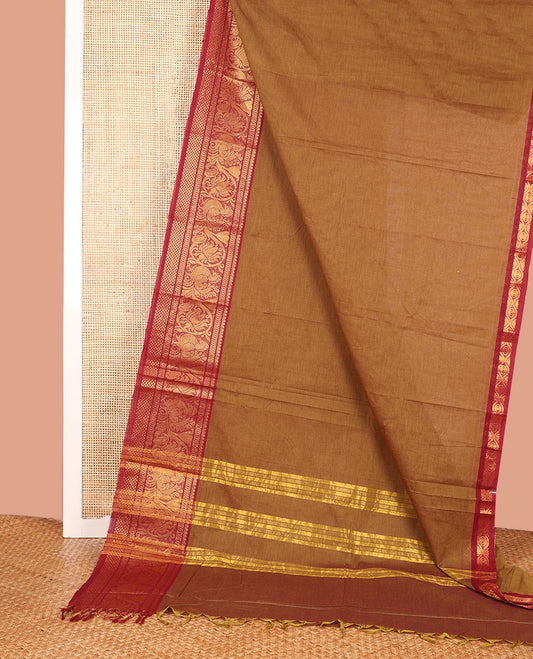 Light Brown Plain Chettinad Cotton Saree, Complemented by a Contrast Traditional Zari Border of Peacock Designs, a Pallu of Zari Stripes, and Paired with a Matching Blouse