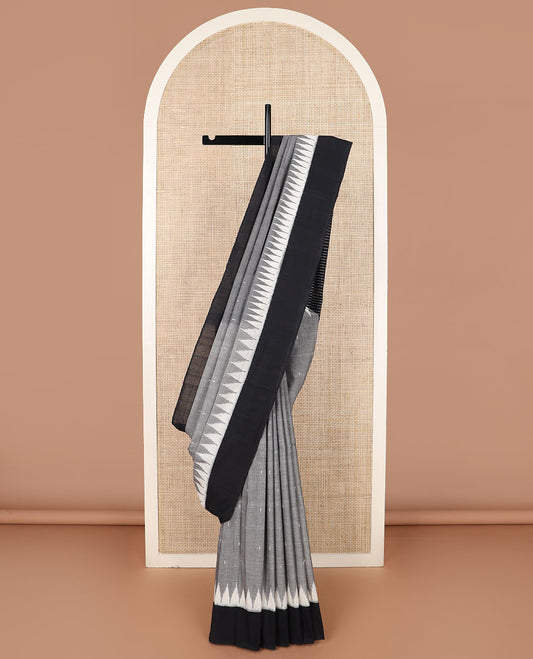 Grey Ikkat Cotton Saree Sparsely Sparkled with Small Buttas All Over Its Body, Complemented by a Contrast Temple Border, and Pallu Steeped with Stripes