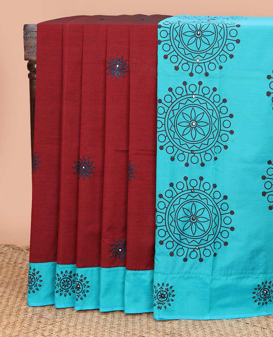 Red sun brust motifs printed with mirror embroidered poly cotton saree, contrast chakra print with mirror work border, and pallu of chakram print, and mirrorwork