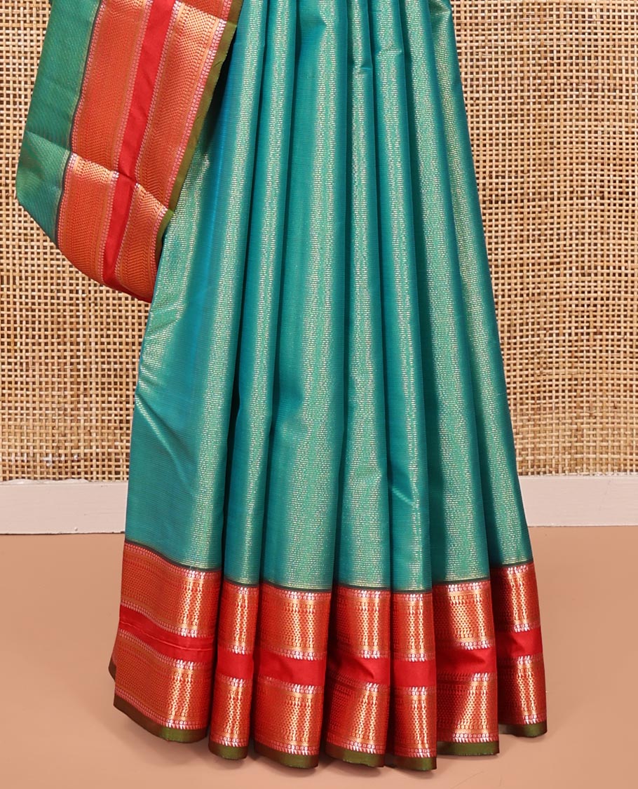 Green Vasundhara Lite Silk Saree, Gleamed up with Zari Vaira Oosi Stripes All Over Its Body, Complemented by Contrast Rettai Pettu Border of Ara Maadam Designs, Grand Pallu and Paired with a Contrast Blouse