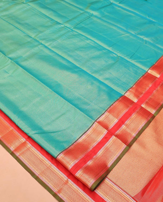 Green Vasundhara Lite Silk Saree, Gleamed up with Zari Vaira Oosi Stripes All Over Its Body, Complemented by Contrast Rettai Pettu Border of Ara Maadam Designs, Grand Pallu and Paired with a Contrast Blouse