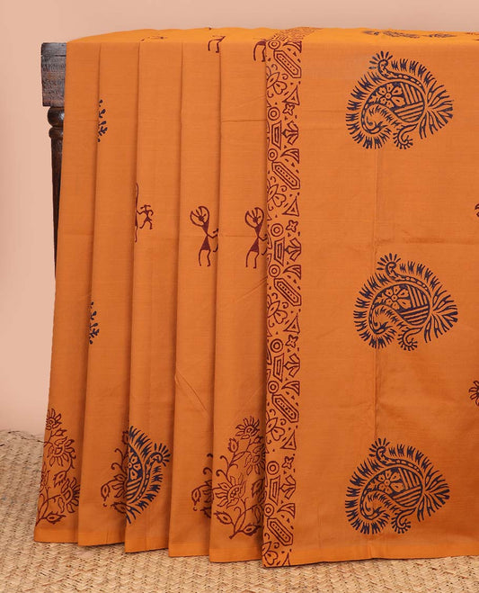 Borderless orange tree and warli motifs printed poly cotton saree, floral-paisley printed pallu