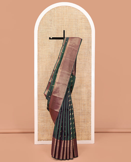 Green Vasundhara Lite Silk Saree, Enriched with Zari Buttas All Over Its Body, Complemented by Contrast Border of Rekku, Poun, Ara Maadam, and Geometric Patterns, Grand Pallu and Paired with a Contrast Blouse
