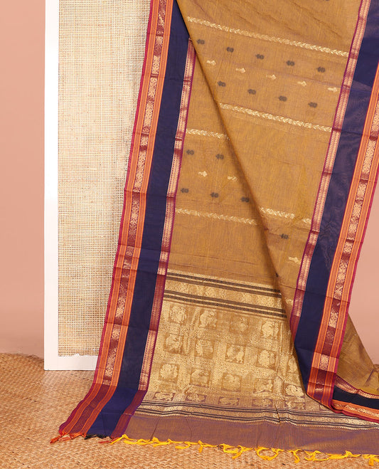 Mustard Chettinad Cotton Saree Subtly Sparkled with Floral Thread Buttas All Over Its Body, Complemented by Contrast Rettai Pettu Border of Traditional Designs, Pallu of Peacock and Yaali Butta Enclosed Checks, and Paired with a Matching Blouse