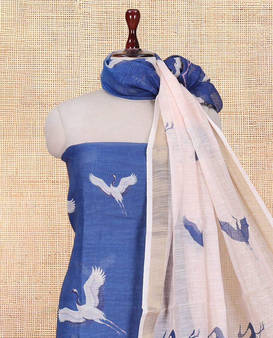 Blue Semi-Linen Material Churidar, Adorned with Heron Motifs Top, a Plain Santoon Bottom, a Contrast Heron Dupatta