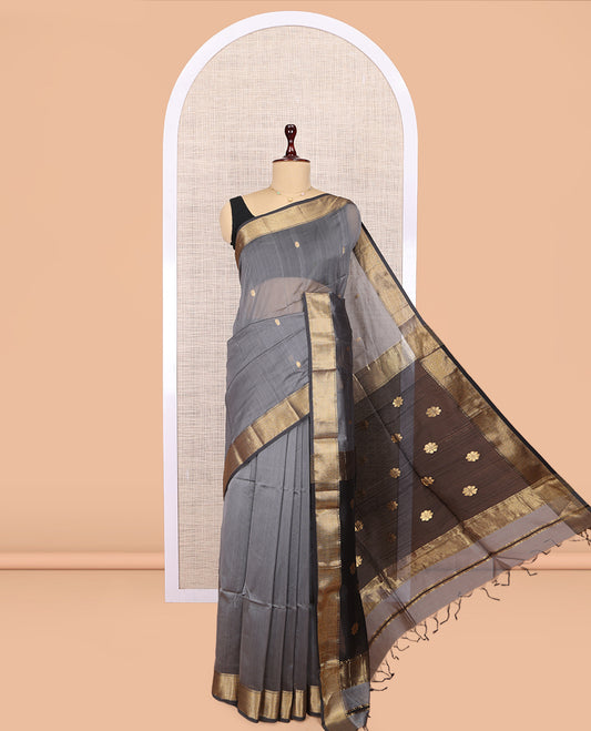 Grey Maheshwari Cotton Saree, Embellished with Buttas, Highlighted by a Traditional Zari Border, Pallu Gleamed Up with Zari Buttas, and a Contrast Blouse