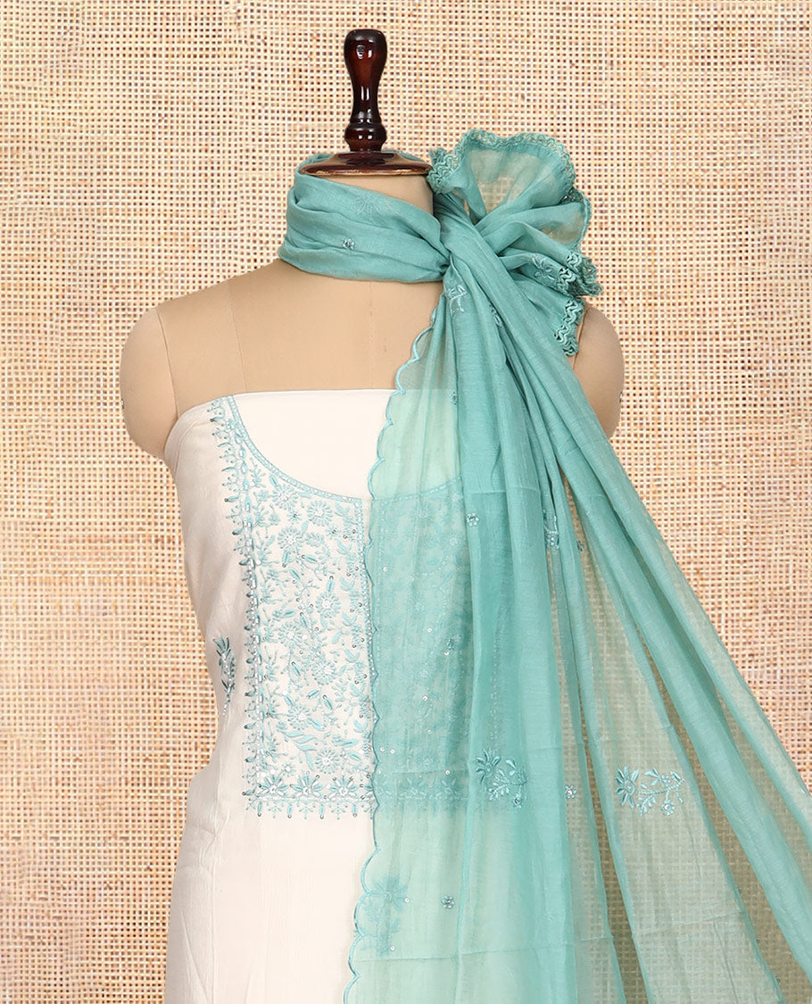 Cream-Sea Green Mul Chanderi Material Churidar Features Thread-Sequins Embroidered Top, a Contrast Bottom, Scallop Embroidered Dupatta