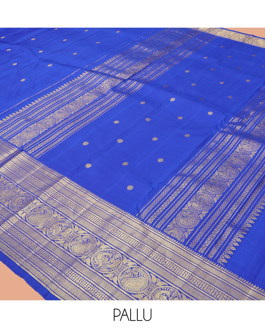 Blue Kanchipuram Silk Saree, Graced with Zari Buttas, Highlighted by Zari Border of Rekku, Vanki, Round Manga, and Round Mayil, Zari Design Pallu, and Matching Blouse