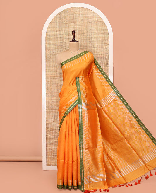 Yellow Plain Banana Pith Saree, Subtle Striped Contrast Border, Pallu of Gleaming Zari Stripes, and Paired with a Matching Blouse