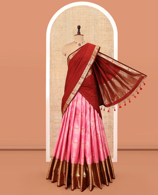 Pink Art Silk Material Half Saree Set, Decorated with Zari Buttas and Checks Skirt, a Contrast Traditional Design Border, Contrast Blouse, and an Intricate Dhavani