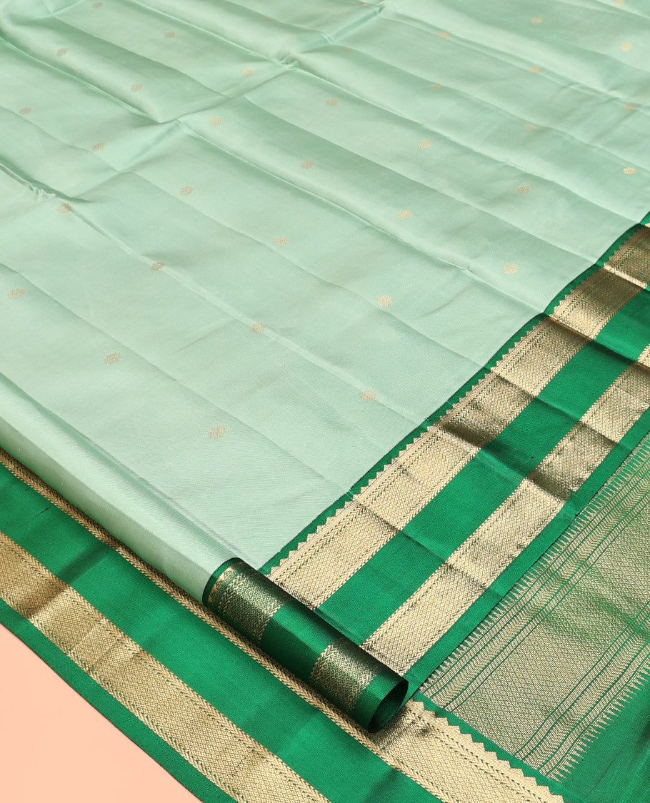 Green Kanchipuram Silk Saree, Woven with Zari Buttas, Contrast Korvai Rettai Pettu Border of Rekku, Kathir, and Mayil Kann Designs, Pallu of Jaal Design, and a Contrast Blouse
