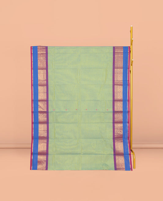 Green Chettinad Cotton Saree, Ornamented with Buttas All Over Its Body, Complemented by a Contrast Traditional Zari Rettai Pettu Border, Pallu of Stripes and Buttas, and Paired with a Matching Blouse