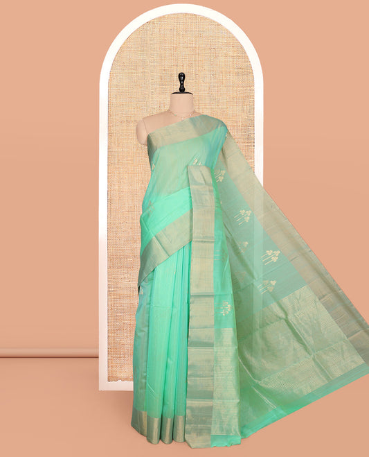 Green Silk Cotton Saree, Graced with Zari Buttas, a Zari Border, Gleaming Zari Pallu, and a Matching Blouse