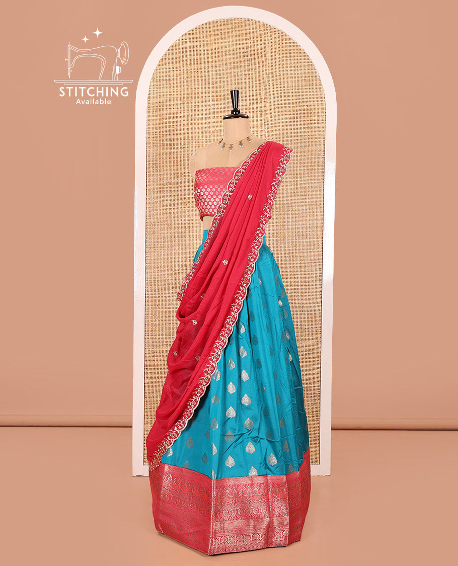 Blue and Rani Pink Semi-Banaras Silk Half-Saree Featuring Zari  Buttas All Over the Skirt, Highlighted with a Contrast Traditional Zari Design Border, Rudraksham Motifs Woven Blouse, and a Shimmer Georgette Scallop-Embroidered Dhavani