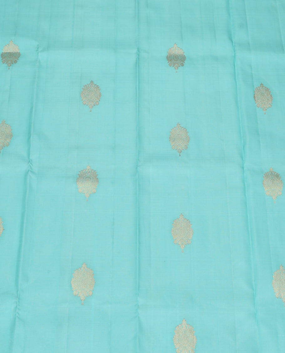 Blue Pure Silk Pavadai Material, Dazzled with Zari Buttas on Its Skirt, a Traditional Zari Border, and a Contrast Blouse