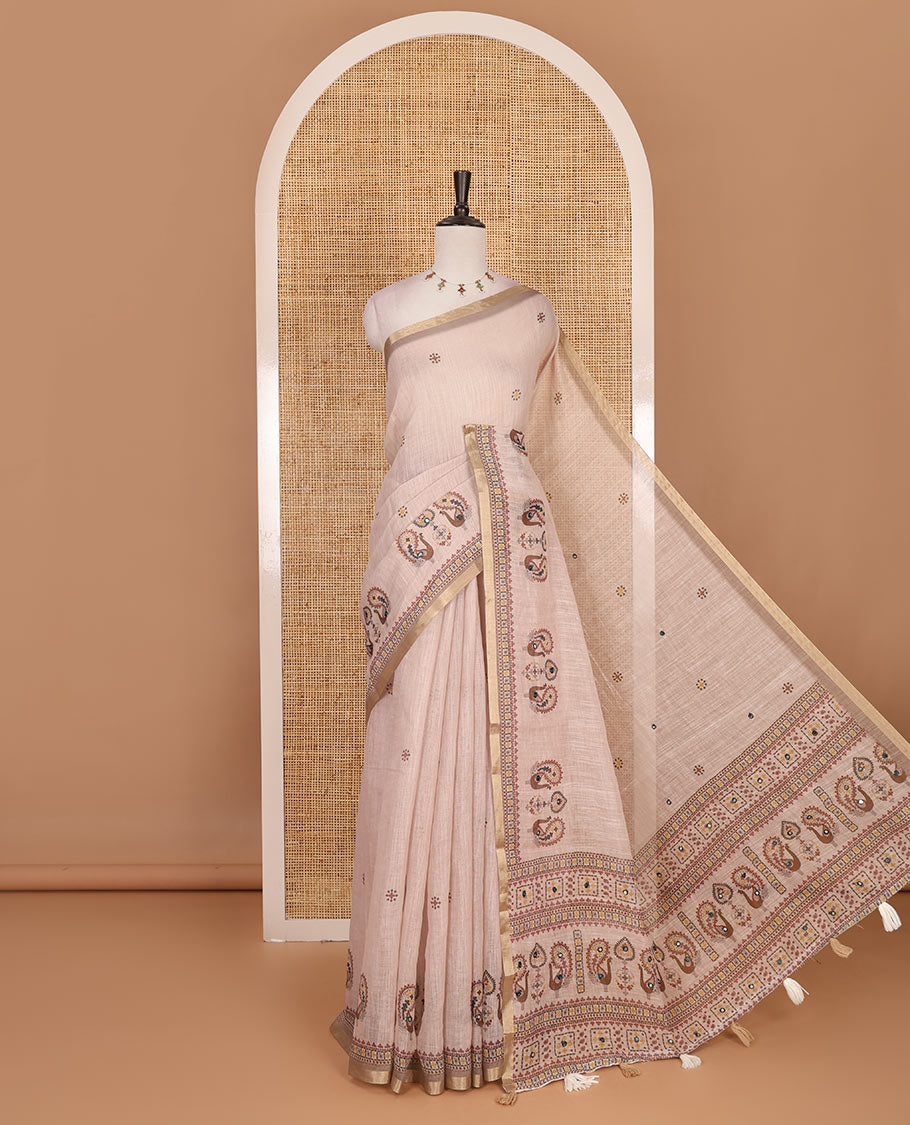 Chikku buttas with mirror work linen saree, zari border with peacock motifs print, printed mirror work pallu, and matching blouse