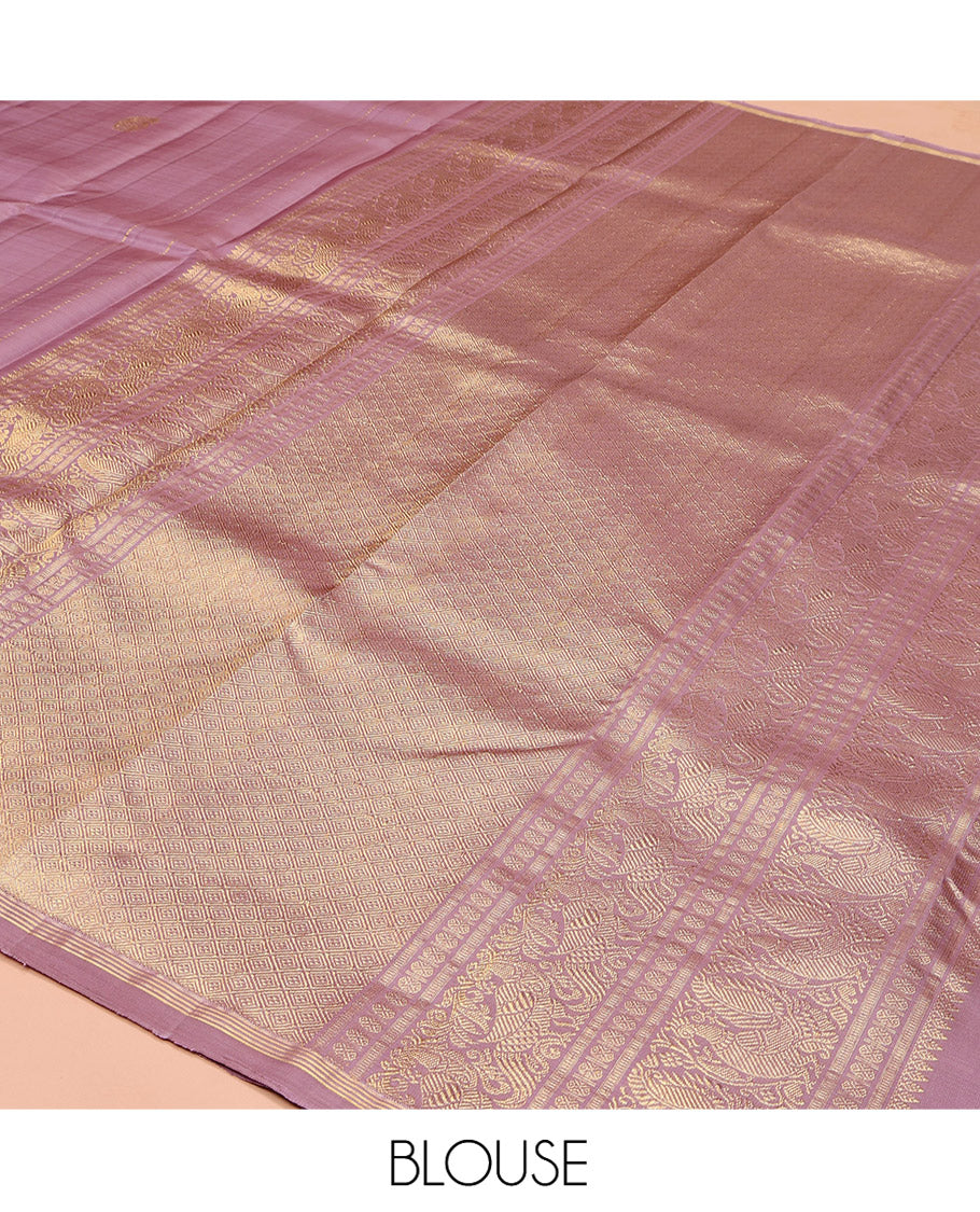Pink Kanchipuram Silk Saree, Beautified with Arumbu Manga Zari Buttas All Over Its Body, Highlighted by a Zari Piping Border, Pallu of Jaal and Mayil Designs, and Paired with a Matching Blouse