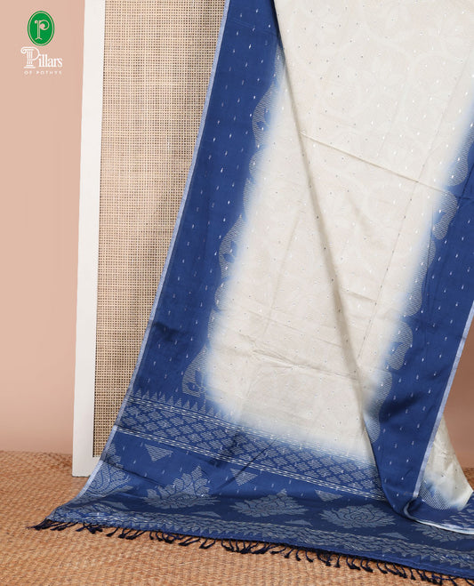 Cream with blue silver zari butta design dola silk saree with contrast border & contrast pallu along with printed blouse
