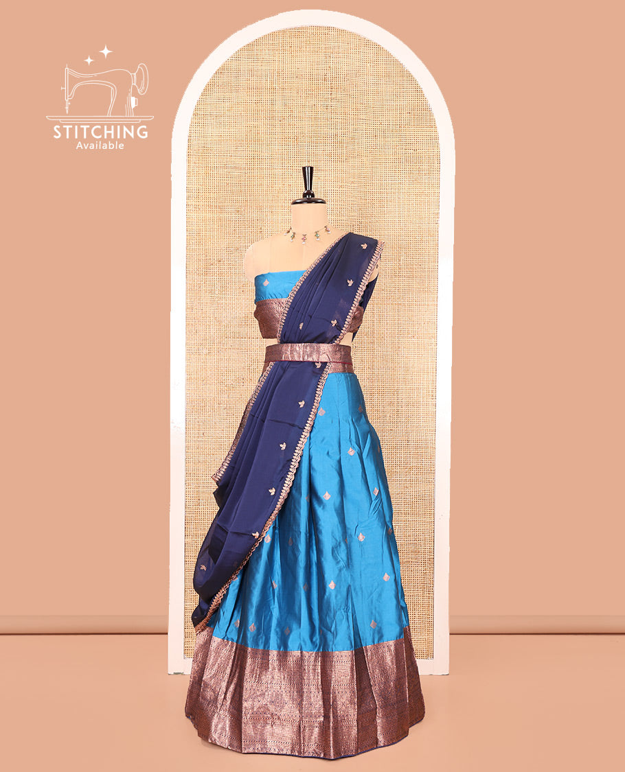 Light Blue and Navy Blue Semi-Banarasi Half-Saree, Spotlighted with Zari Buttas on Its Skirt, Complemented by a Contrast Traditional Zari Designs Woven Border, Paired with a Matching Blouse, and a Contrast Satin Georgette Embroidered Scallop Dhavani