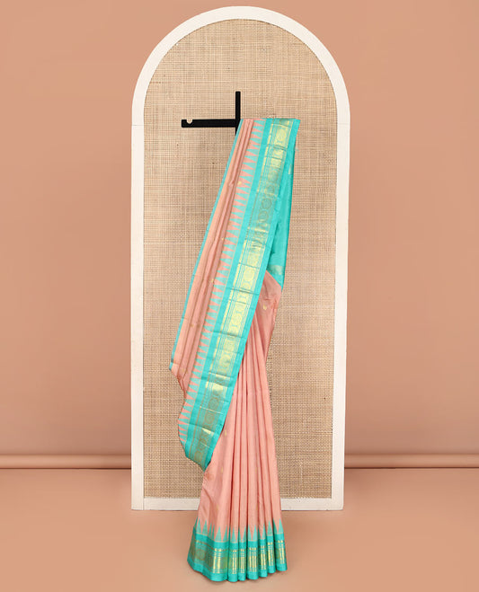 Pink Kanchipuram Silk Saree, Featuring Zari Buttas, Complemented by a Contrast One-Sided Thazampoo Rekku Border of Thilakam Mokku, Banaras, Muthu, and Chakram Designs, Pallu of Zari Designs, and Comes Without a Blouse