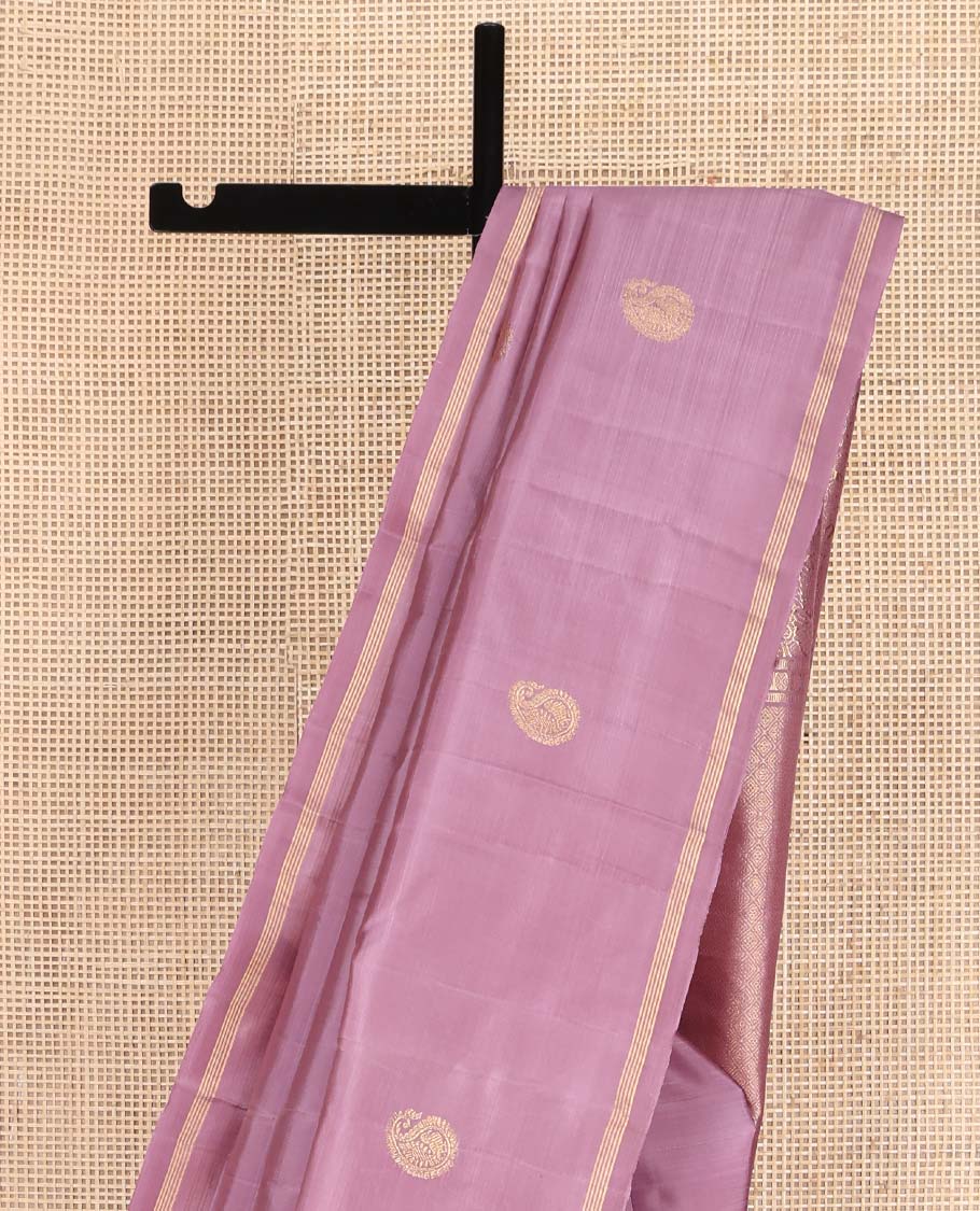 Pink Kanchipuram Silk Saree, Beautified with Arumbu Manga Zari Buttas All Over Its Body, Highlighted by a Zari Piping Border, Pallu of Jaal and Mayil Designs, and Paired with a Matching Blouse