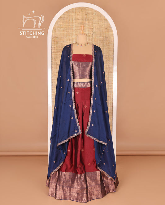 Maroon taffeta silk half-saree, zari buttas and contrast traditional zari bordered skirt, a matching taffeta silk blouse, and contrast embroidered satin georgette  dhavani