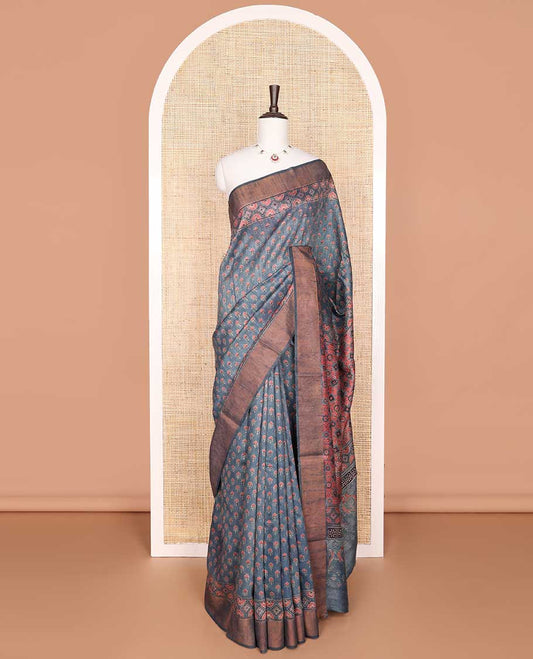 Blue floral motifs tussar silk saree with contrast zari design border & geometric design pallu