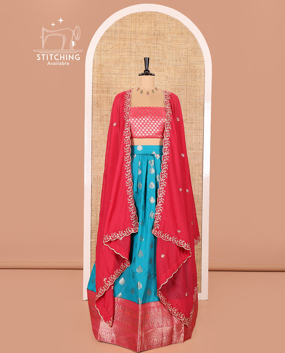 Blue and Rani Pink Semi-Banaras Silk Half-Saree Featuring Zari  Buttas All Over the Skirt, Highlighted with a Contrast Traditional Zari Design Border, Rudraksham Motifs Woven Blouse, and a Shimmer Georgette Scallop-Embroidered Dhavani