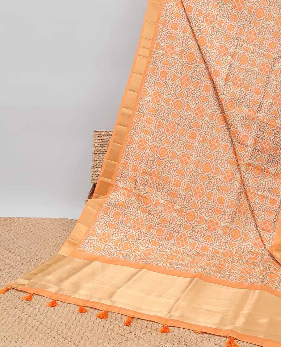 Cream ikkat style floral design tissue saree with contrast zari border & zari design pallu