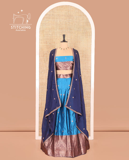 Light Blue and Navy Blue Semi-Banarasi Half-Saree, Spotlighted with Zari Buttas on Its Skirt, Complemented by a Contrast Traditional Zari Designs Woven Border, Paired with a Matching Blouse, and a Contrast Satin Georgette Embroidered Scallop Dhavani