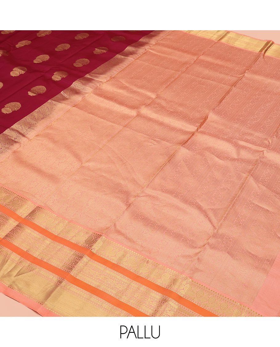 Maroon Vasundhara Silk Saree, Detailed with Floral Zari Buttas All Over Its Body, Complemented by a Contrast Border of Salngai, Mayil, Rettai Neli, and Kodi Visiry Designs, Pallu Steeped with Kodi Visiry Designs, and Paired with a Contrast Blouse