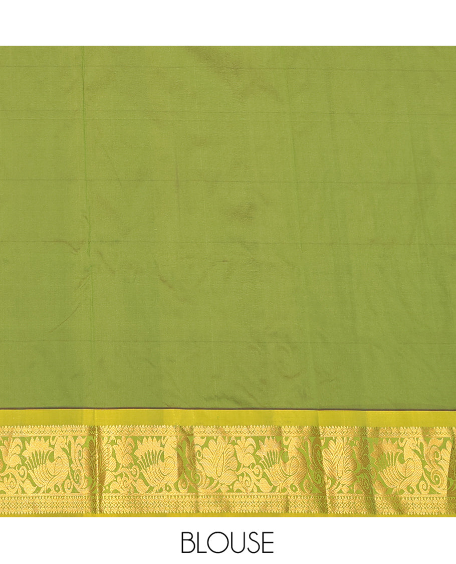 Green Art Silk Pavadai Material Set Featuring Zari Designs on Its Skirt, Complemented by a Contrast Traditional Zari Border, and a Matching Blouse