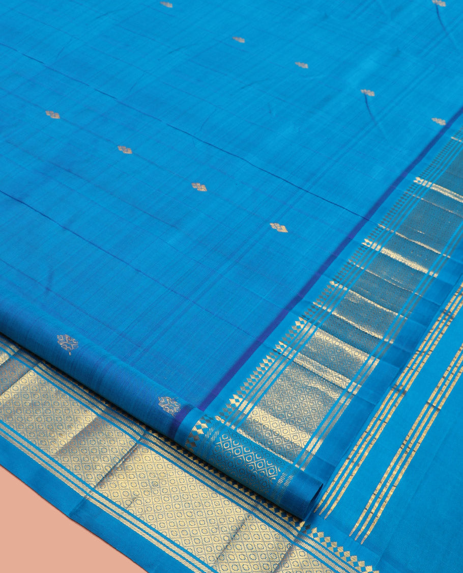 Blue Kanchipuram Silk Saree, Detailed with Zari Buttas, a One-Sided Border Featuring Panner Sombu, Banaras, and Jaal Design, Pallu of Kodi Visiry, and No Blouse