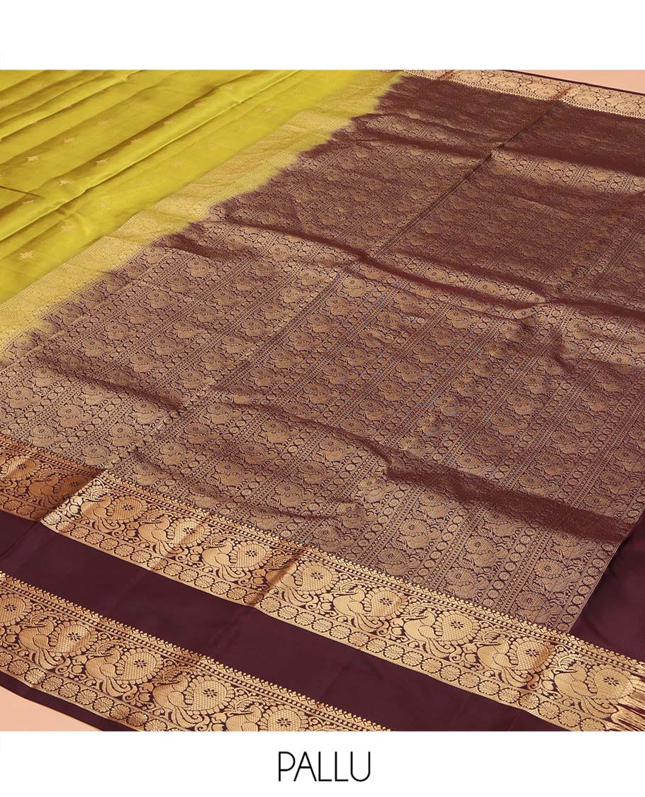 Green Vasundhara Lite Silk Mix Saree, Finely Crafted with Zari Buttas on Its Body, Complemented by Contrast Rettai Pettu Border of Mayil and Laddu Kamalam Designs, Pallu Mirrors the Same Designs, and Paired with a Contrast Blouse