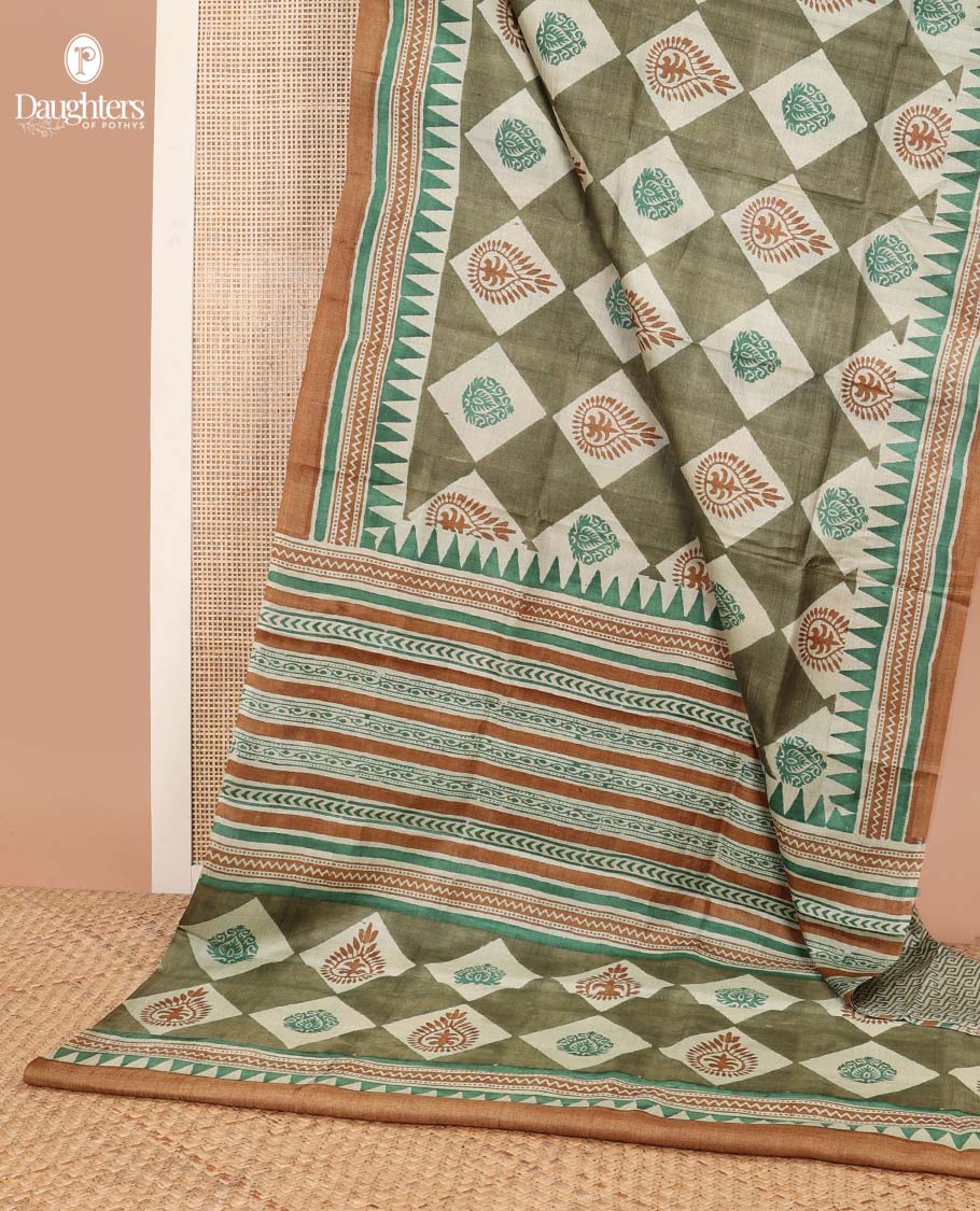 Olive green block floral print tussar saree with contrast geometric design border & floral design pallu